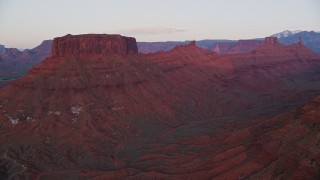 5.5K aerial stock footage of approaching two buttes and Castleton Tower, Moab, Utah, sunset Aerial Stock Footage | AX138_407E