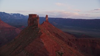 5.5K aerial stock footage of approaching and orbiting Castleton Tower at sunset, Moab, Utah Aerial Stock Footage | AX138_414E