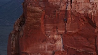 5.5K aerial stock footage of a rock climber on Castleton Tower, Moab, Utah, sunset Aerial Stock Footage | AX138_419E