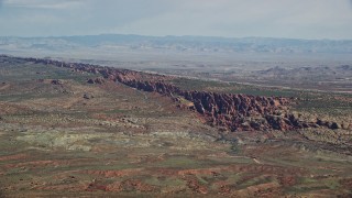 5.5K aerial stock footage of passing by Devil's Garden in Arches National Park, Utah Aerial Stock Footage | AX139_003E