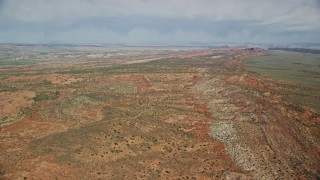 5.5K aerial stock footage of flying over open desert in Arches National Park, Utah Aerial Stock Footage | AX139_005