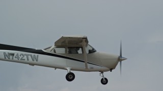 5.5K aerial stock footage of flying beside a Cessna over desert mountains, closeup on cockpit, Carbon County, Utah Aerial Stock Footage | AX139_143E