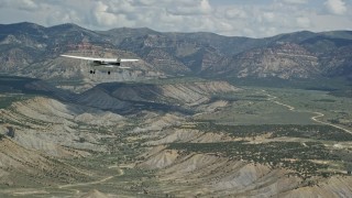 5.5K aerial stock footage of a Cessna plane over desert, approaching distant mountains, Carbon County, Utah Aerial Stock Footage | AX140_007E