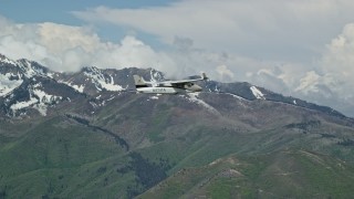 5.5K aerial stock footage of a Tecnam P2006T flying near snowy Freedom Peak, Wasatch Range, Utah Aerial Stock Footage | AX140_105