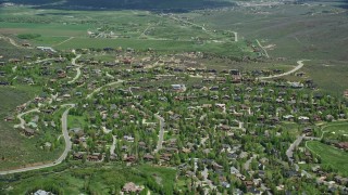 AX140_205E - 5.5K aerial stock footage of flying by upscale homes in Park City, Utah