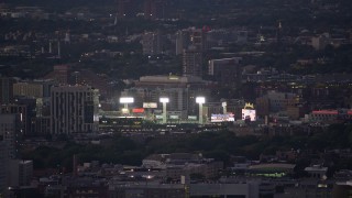 5.5K aerial stock footage flying by a baseball game at Fenway Park, Boston, Massachusetts, twilight Aerial Stock Footage | AX141_012E