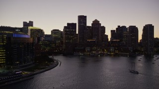 5.5K aerial stock footage approaching Two International Place, skyline, Downtown Boston, Massachusetts, twilight Aerial Stock Footage | AX141_023E