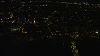 AX141_092E - 5.5K aerial stock footage flying away from Lowell House, Harvard University, Massachusetts, night