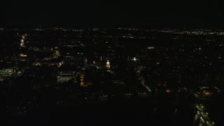 AX141_118E - 5.5K aerial stock footage flying by Lowell House, John W. Weeks Bridge, Harvard University, Massachusetts, night