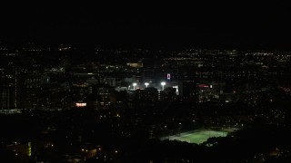 5.5K aerial stock footage flying by downtown buildings, Fenway Park, Boston, Massachusetts, night Aerial Stock Footage | AX141_135E