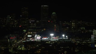 5.5K aerial stock footage flying by lights of Fenway Park, Downtown Boston, Massachusetts, night Aerial Stock Footage | AX141_142