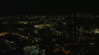 AX141_147E - 5.5K aerial stock footage flying by Massachusetts Institute of Technology, office buildings, Cambridge, Massachusetts, night