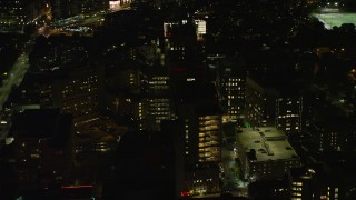 AX141_175E - 5.5K aerial stock footage orbiting Beth Israel Hospital, Longwood Medical Area, Boston, Massachusetts, night