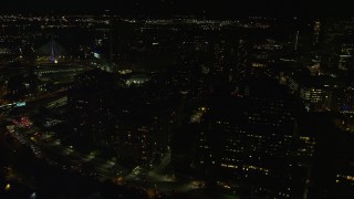 5.5K aerial stock footage flying by city streets, office buildings, West End, Downtown Boston, Massachusetts, night Aerial Stock Footage | AX141_194E