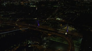 5.5K aerial stock footage flying by the Zakim Bridge, Boston, Massachusetts, night Aerial Stock Footage | AX141_201