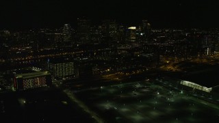 5.5K aerial stock footage flying over city lights, approaching skyline, Downtown Boston, Massachusetts, night Aerial Stock Footage | AX141_233E