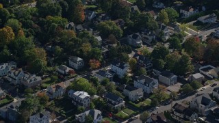 5.5K aerial stock footage flying over homes, small town, colorful trees in autumn, Hyde Park, Massachusetts Aerial Stock Footage | AX142_010E