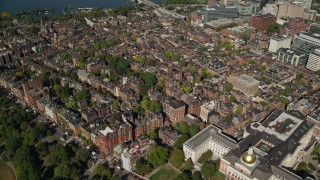 AX142_040 - 5.5K aerial stock footage of Massachusetts State House, Beacon Hill, Downtown Boston, Massachusetts