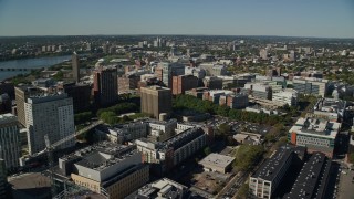 5.5K aerial stock footage flying by office buildings, large crane, Cambridge, Massachusetts Aerial Stock Footage | AX142_051E