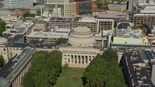 AX142_055E - 5.5K aerial stock footage flying by Massachusetts Institute of Technology, Cambridge, Massachusetts