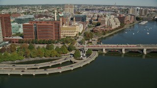 AX142_071E - 5.5K aerial stock footage tracking commuter train across the Longfellow Bridge, Cambridge, Massachusetts