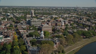 AX142_121E - 5.5K aerial stock footage flying over Anderson Memorial Bridge, Harvard University, Cambridge, Massachusetts