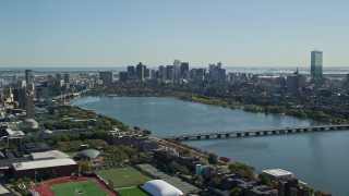 AX142_126E - 5.5K aerial stock footage flying by skyline from over MIT, Downtown Boston, Massachusetts