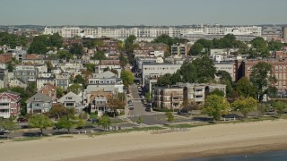 AX142_212 - 5.5K aerial stock footage flying by beachfront homes, South Boston, Massachusetts