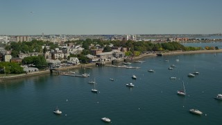 5.5K aerial stock footage flying by piers, anchored boats, South Boston, Massachusetts Aerial Stock Footage | AX142_213E