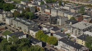 5.5K aerial stock footage flying by apartment buildings, tilt down, South Boston, Massachusetts Aerial Stock Footage | AX142_237