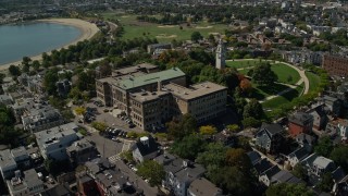 AX142_241E - 5.5K aerial stock footage of South Boston Education Complex, tilt down, South Boston, Massachusetts