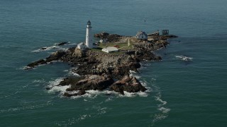 AX142_258E - 5.5K aerial stock footage orbiting the Boston Light, Little Brewster Island, Boston Harbor, Massachusetts