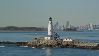 5.5K aerial stock footage orbiting top of Boston Light, Little Brewster Island, Boston Harbor, Massachusetts Aerial Stock Footage | AX142_264E