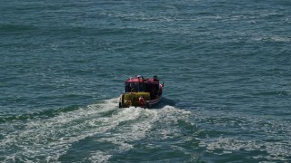 AX142_267 - 5.5K aerial stock footage tracking a lobster fishing boat on Boston Harbor, Massachusetts