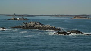 5.5K aerial stock footage of Shag Rocks, Boston Light, Little Brewster Island, Boston Harbor, Massachusetts Aerial Stock Footage | AX142_273