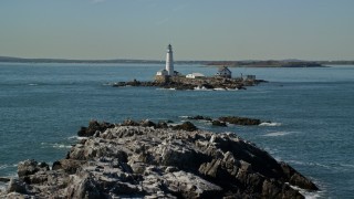 AX142_274E - 5.5K aerial stock footage of Shag Rocks, Boston Light, Little Brewster Island, Boston Harbor, Massachusetts