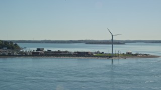 AX142_278E - 5.5K aerial stock footage flying by small coastal town, windmill, Hull, Massachusetts