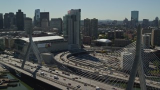 AX142_299E - 5.5K aerial stock footage flying by the Zakim Bridge and TD Garden, Boston, Massachusetts