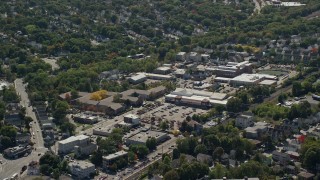 5.5K aerial stock footage flying by large strip mall, neighborhoods, Hyde Park, Massachusetts Aerial Stock Footage | AX142_317E