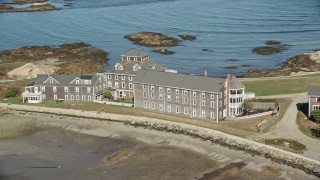 5.5K aerial stock footage flying by isolated upscale oceanfront home, Scituate, Massachusetts Aerial Stock Footage | AX143_030