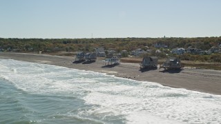 5.5K aerial stock footage flying by oceanfront homes, waves crashing on beach, Scituate, Massachusetts Aerial Stock Footage | AX143_034