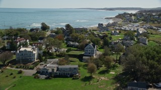 5.5K aerial stock footage flying by rocky beach, oceanfront homes, Scituate, Massachusetts Aerial Stock Footage | AX143_042E