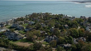 5.5K aerial stock footage flying by upscale oceanfront homes, Scituate, Massachusetts Aerial Stock Footage | AX143_044