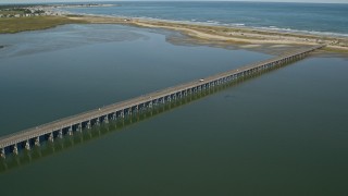 AX143_066E - 5.5K aerial stock footage flying over marshland, approach and orbit Powder Point Bridge, Duxbury, Massachusetts