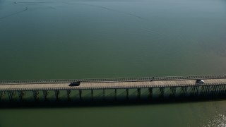 AX143_070E - 5.5K aerial stock footage orbiting Powder Point Bridge, light traffic, Duxbury, Massachusetts