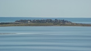 AX143_082E - 5.5K aerial stock footage flying low by Plymouth Light, coastal community, Duxbury, Massachusetts