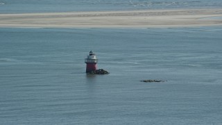 AX143_084 - 5.5K aerial stock footage flying by Plymouth Light in Plymouth Harbor, Plymouth, Massachusetts