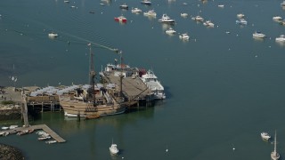 5.5K aerial stock footage orbiting Mayflower II, Mayflower II Museum, Plymouth, Massachusetts Aerial Stock Footage | AX143_089