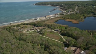 5.5K aerial stock footage orbiting Plimoth Plantation, coastal community, Plymouth, Massachusetts Aerial Stock Footage | AX143_110E