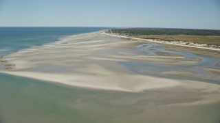 5.5K aerial stock footage flying over sand bars, approach small coastal town, Cape Cod, Dennis, Massachusetts Aerial Stock Footage | AX143_147E